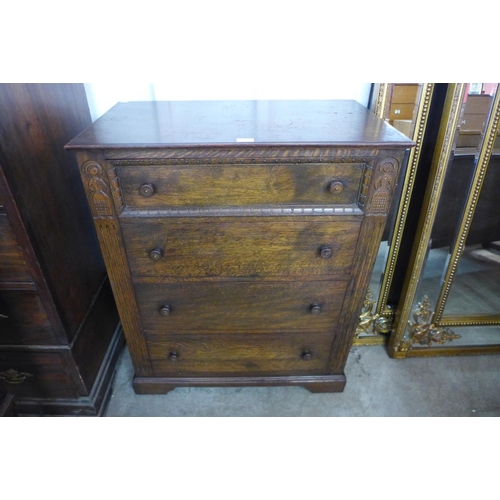 72 - A carved Ipswich oak chest of drawers