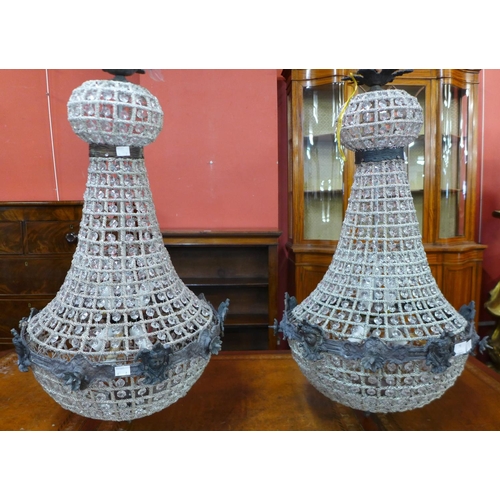 79 - A pair of French Empire style white metal and glass chandeliers, 75cms h