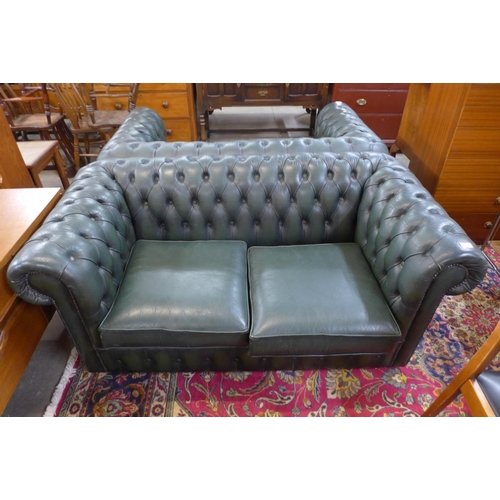 88 - A green leather Chesterfield settee