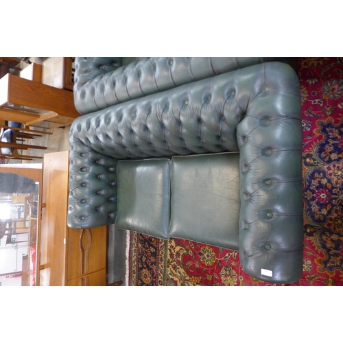 88 - A green leather Chesterfield settee