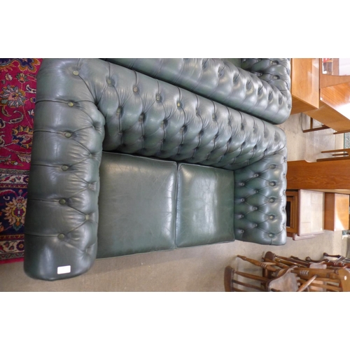 89 - A green leather Chesterfield settee