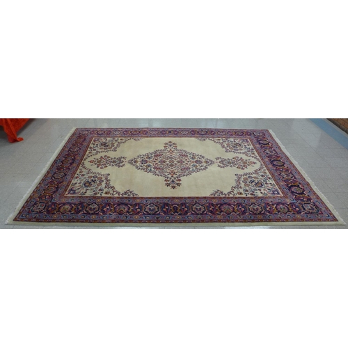 91 - A large cream ground geomertic patterned rug, 360 x 253cms