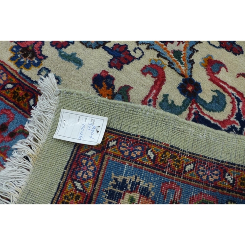 91 - A large cream ground geomertic patterned rug, 360 x 253cms