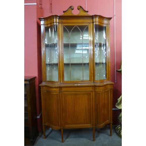 95 - A late Victorian Sheraton Revival inlaid satinwood display cabinet, 224cms h, 126cms w, 45cms d.