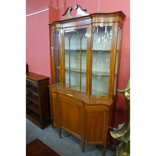 95 - A late Victorian Sheraton Revival inlaid satinwood display cabinet, 224cms h, 126cms w, 45cms d.