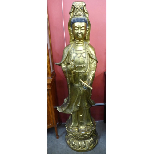 96 - A large oriental gilt bronze figure of a deity