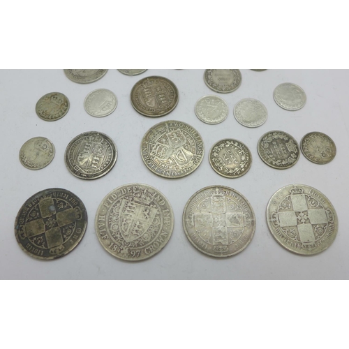 1026 - Assorted Victorian silver coins including three gothic head florins, and one George V 3d, 96.4g