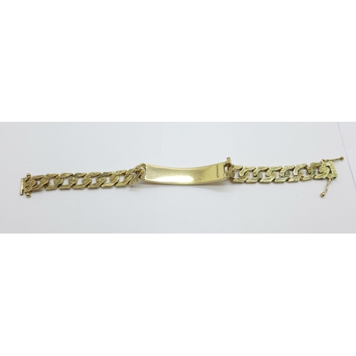 1032 - A 9ct gold bark design ID bracelet, 29.5g