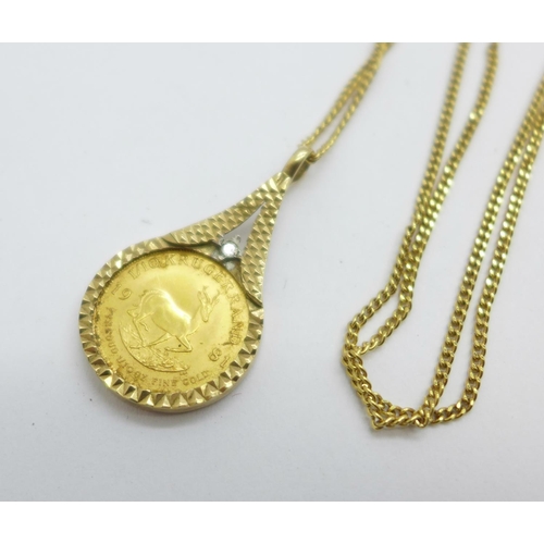 1041 - A 1981 1/10 fine gold Krugerrand in a 9ct gold mount set with a diamond and on a 9ct gold chain, tot... 