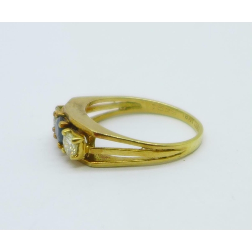 1052 - An 18ct gold, sapphire and diamond three stone ring, 4g, O, the diamonds approximately 0.25ct each