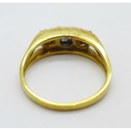 1052 - An 18ct gold, sapphire and diamond three stone ring, 4g, O, the diamonds approximately 0.25ct each