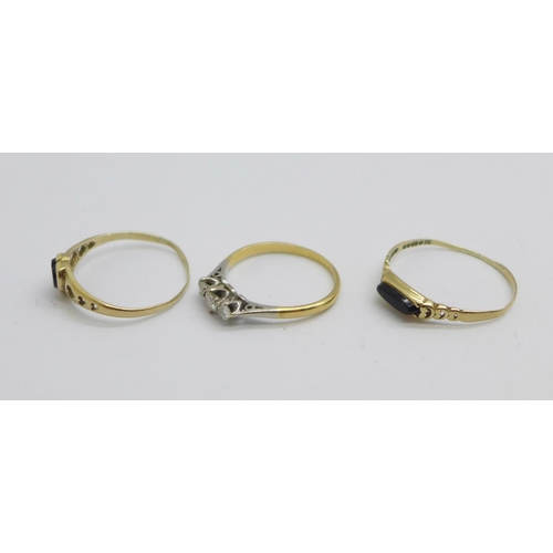 1073 - An 18ct gold, three stone diamond ring, 1.6g, N, and two 9ct gold rings, 1.7g, both Q/R