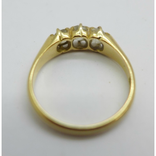 1074 - An 18ct gold, three stone diamond ring, 3.2g, N, approximately 0.75ct total diamond weight