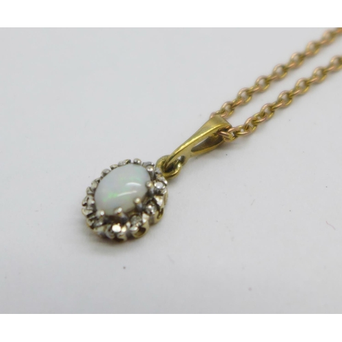 1079 - A 9ct gold, opal and diamond pendant with chain