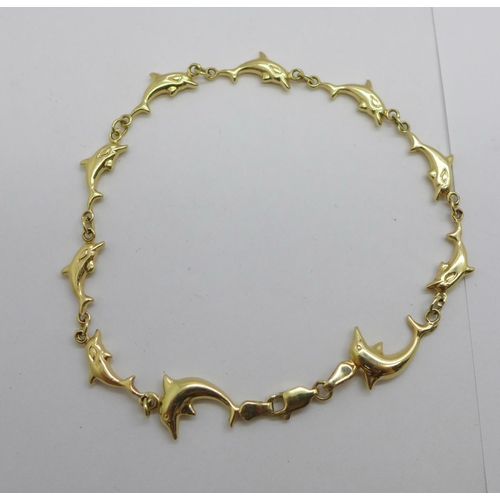 1083 - A 14ct gold dolphin bracelet, 5g