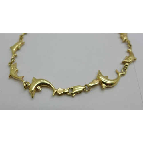 1083 - A 14ct gold dolphin bracelet, 5g