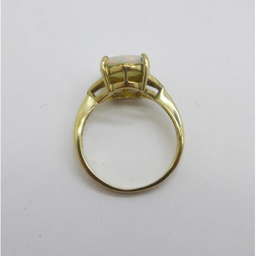 1090 - A 9ct gold and opal ring with diamond shoulders, 2.4g, L