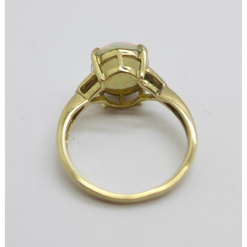 1090 - A 9ct gold and opal ring with diamond shoulders, 2.4g, L