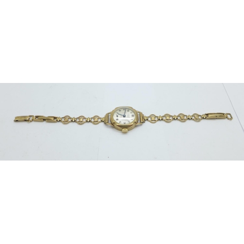 1109 - A lady's 9ct gold cased wristwatch on a 9ct gold bracelet strap, total weight with movement 14.5g