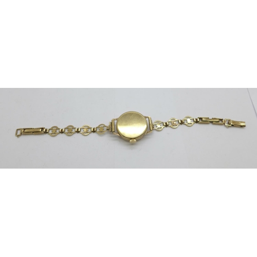 1109 - A lady's 9ct gold cased wristwatch on a 9ct gold bracelet strap, total weight with movement 14.5g