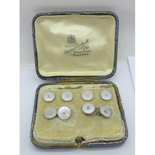 1116 - A cased set of 18ct white gold, diamond and mother of pearl cufflinks and dress studs/buttons, 9.5g