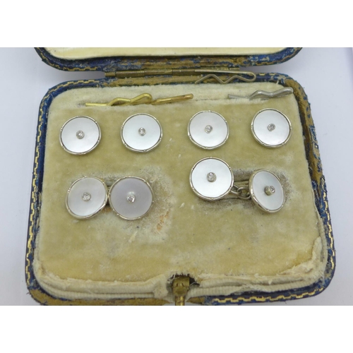 1116 - A cased set of 18ct white gold, diamond and mother of pearl cufflinks and dress studs/buttons, 9.5g