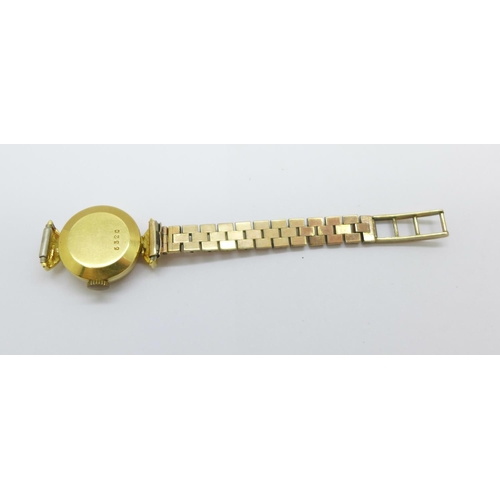 1124 - A lady's 18ct gold cased wristwatch, case 6.4g without movement, and one half of a 9ct gold bracelet... 