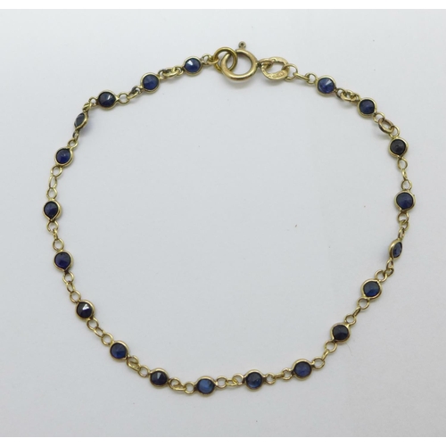 1126 - A fine 9ct gold and sapphire bracelet, 1.3g