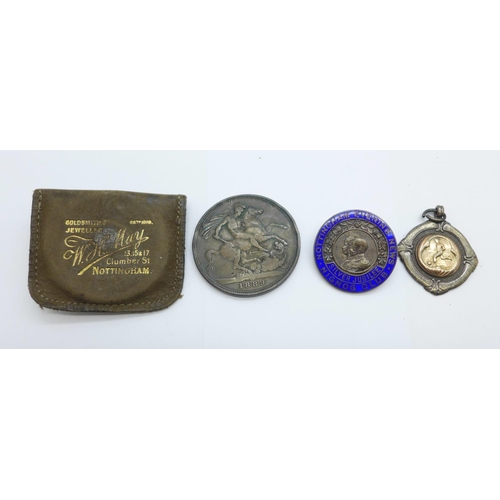 1128 - A Victorian silver crown, 1889, a silver football fob medal and a silver badge