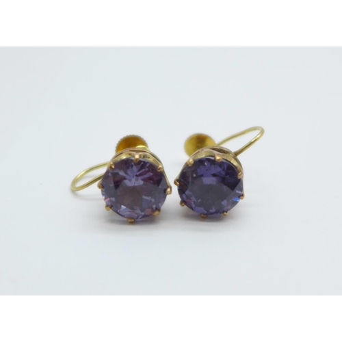 1129 - A pair of 9ct gold and amethyst earrings with screw backs, 3.6g