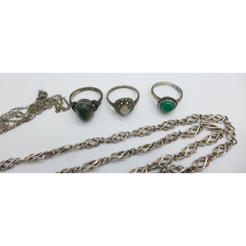 1141 - A silver chain, four rings, a bracelet, a thistle pendant, a blue stone set pendant and chain and a ... 