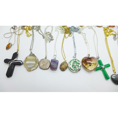 1157 - Thirty-one pendants with chains including silver, amber and hardstone