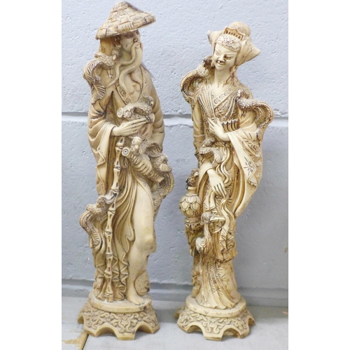 1229 - A pair of oriental resin figures