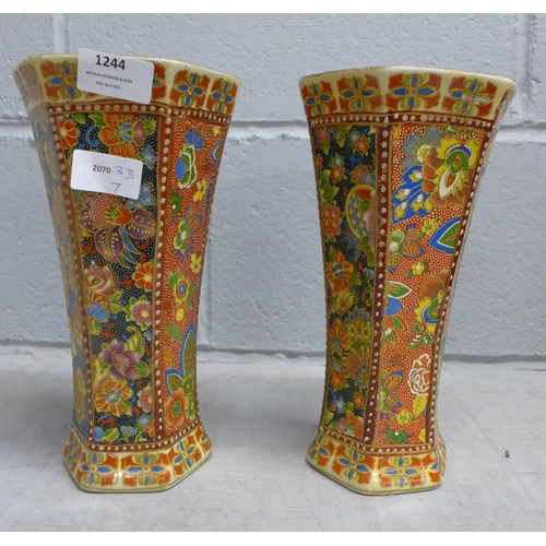 1244 - A pair of oriental style vases **PLEASE NOTE THIS LOT IS NOT ELIGIBLE FOR POSTING AND PACKING**