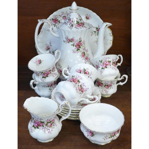 674 - A Royal Albert Lavender Rose six setting coffee set, one saucer repaired