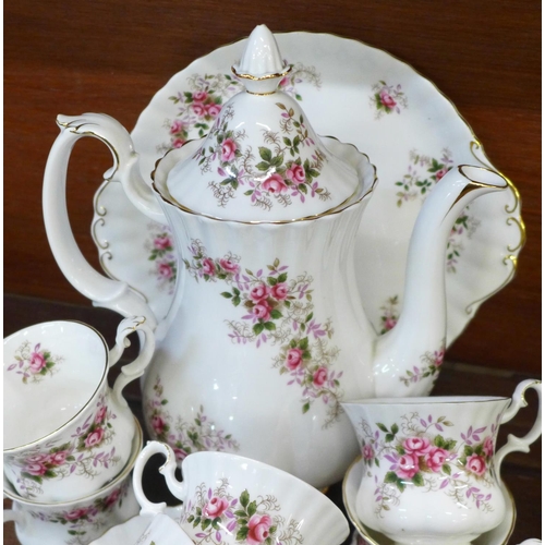 674 - A Royal Albert Lavender Rose six setting coffee set, one saucer repaired