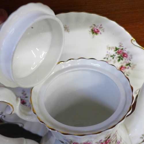 674 - A Royal Albert Lavender Rose six setting coffee set, one saucer repaired