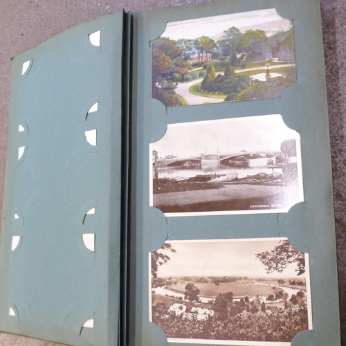 677 - Postcards; a vintage postcard album and collection (102 cards)