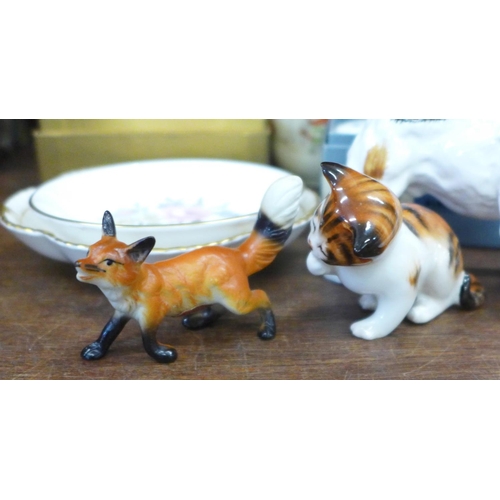 678 - A Royal Doulton Jack Russell terrier licking a plate, a kitten, Wade tortoise, china fox, Wedgwood t... 