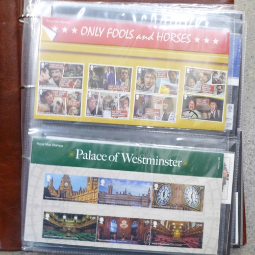 695 - Stamps; an album of GB presentation packs, thirty-eight packs with a face value exceeding £80