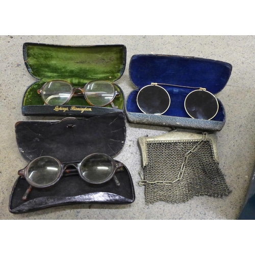 723 - Nine pairs of vintage spectacles, Georgian and later chain mail purses, lustre drops, etc.