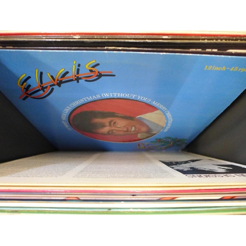 743 - Elvis, a collection of LP records, CD singles box set and a tin with book and nine magnet set