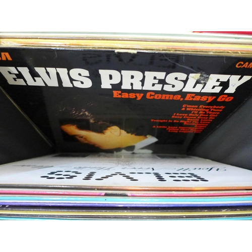 743 - Elvis, a collection of LP records, CD singles box set and a tin with book and nine magnet set