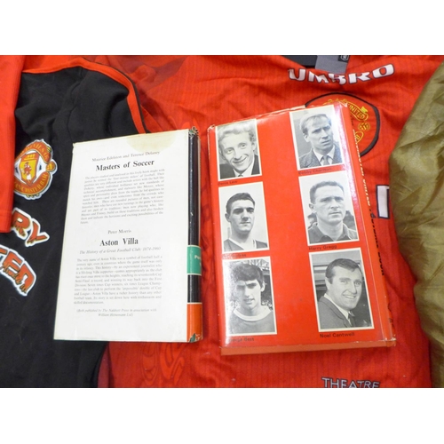 752 - Manchester United football shirts, a t shirt, flag and two books