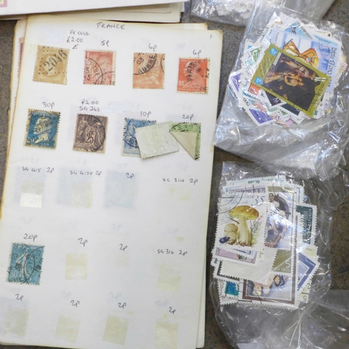 754 - A collection of stamps and a reference book