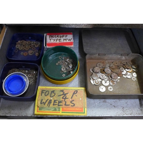 781 - A metal four drawer cabinet of pocket watch parts