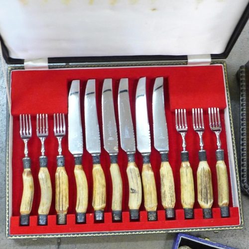 800 - A set of six horn handled steak knives and forks, cased, one other set of six horn handled steak kni... 