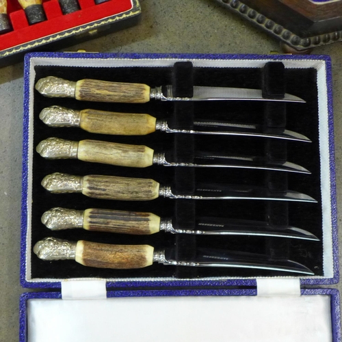 800 - A set of six horn handled steak knives and forks, cased, one other set of six horn handled steak kni... 