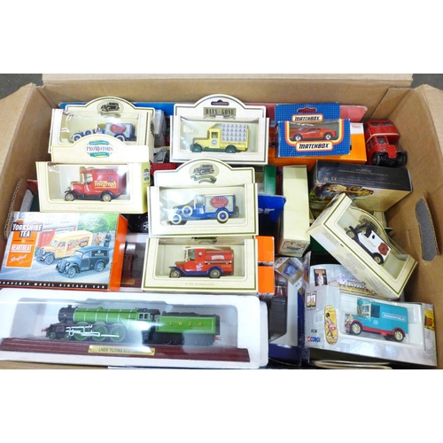 803 - A box of Lledo. Corgi, Matchbox and other model vehicles including Esso Car Transporter, Road Tanker... 