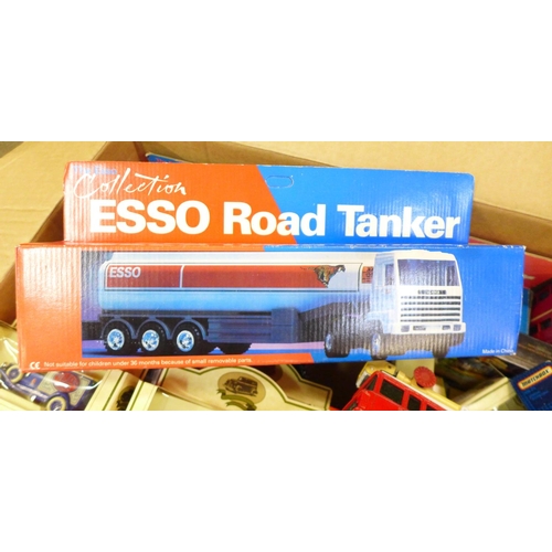 803 - A box of Lledo. Corgi, Matchbox and other model vehicles including Esso Car Transporter, Road Tanker... 